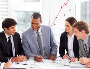 Smiling business people showing diversity in a meeting